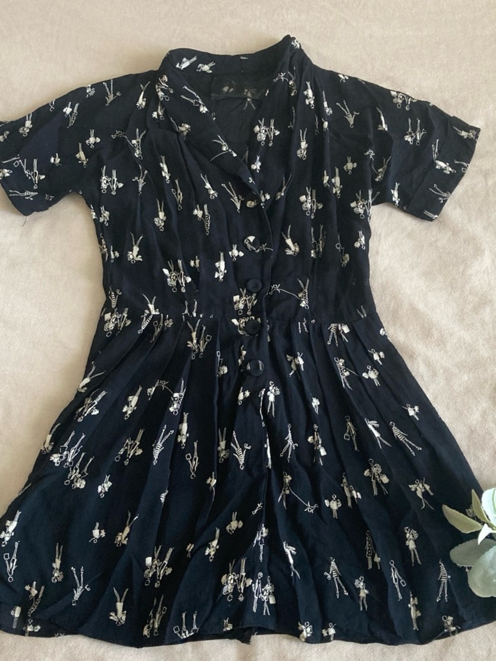Reformation Black Short-Sleeve Romper with White Figurine Print